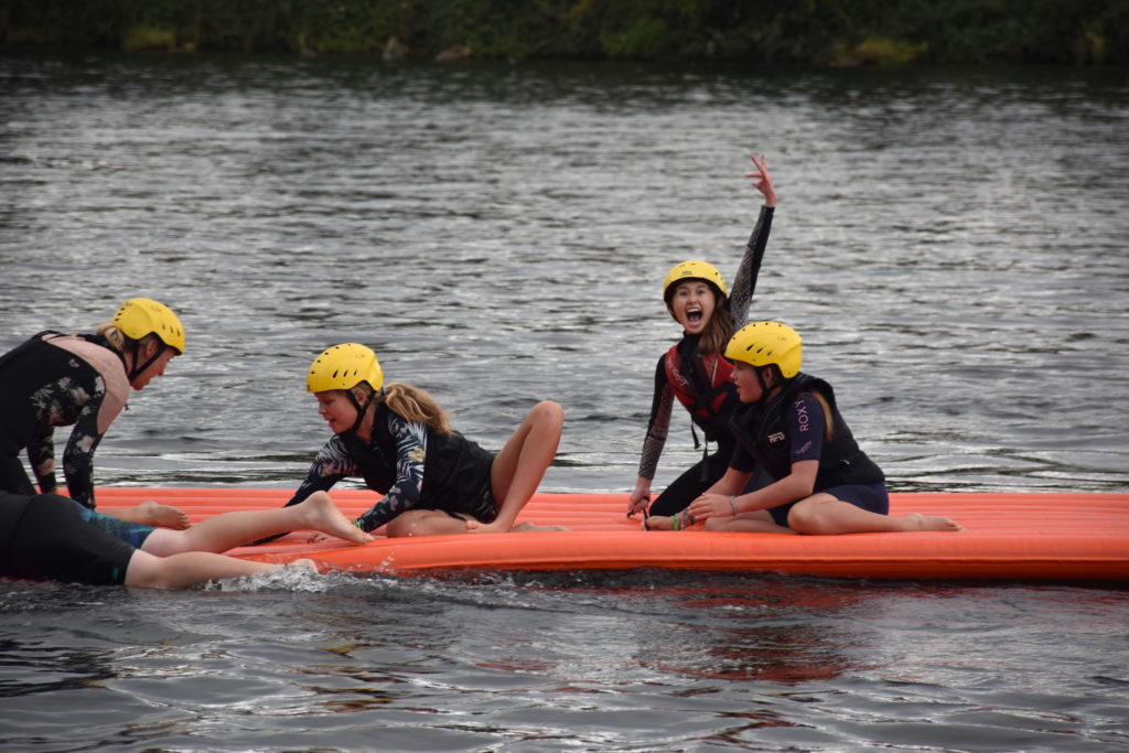camp paddleboarding